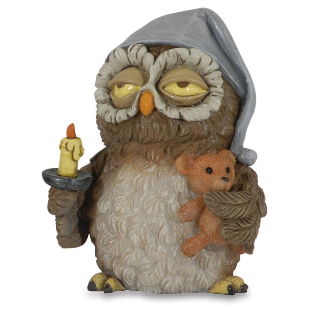 A figurine of a sleepy owl wearing a nightcap, holding a candle and a teddy bear.