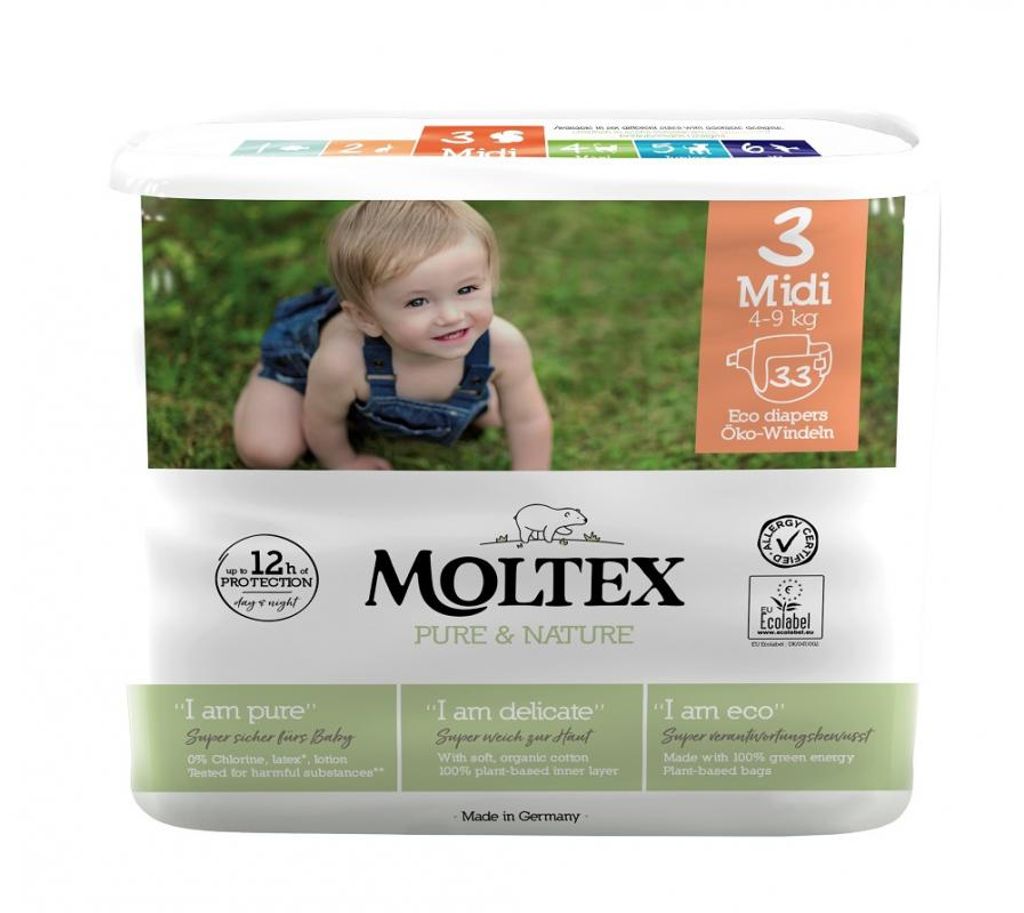 A package of Moltex Pure & Nature Midi diapers with a baby crawling on grass in the background.