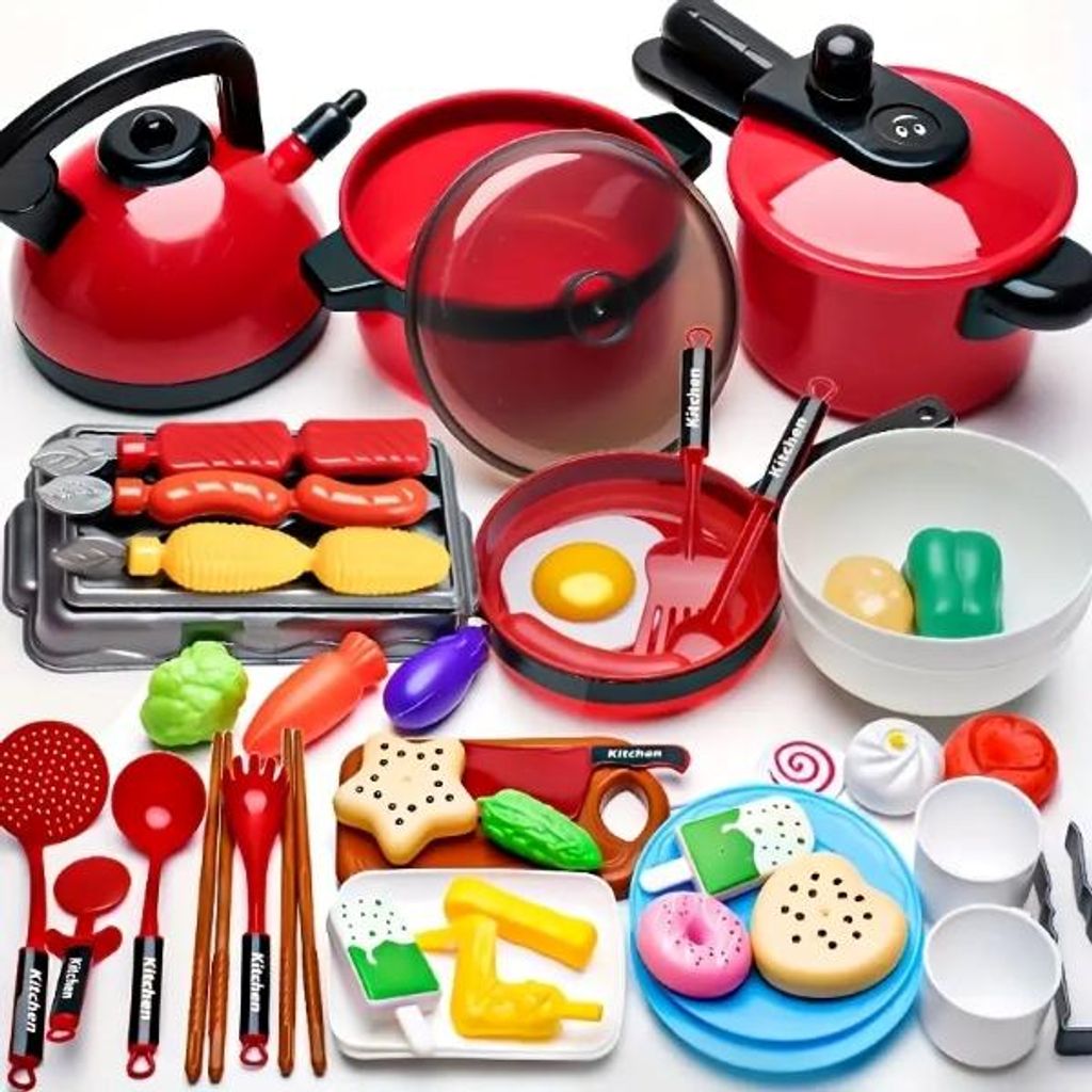 A collection of toy kitchen accessories, including pots, pans, utensils, and play food, arranged on a white background.