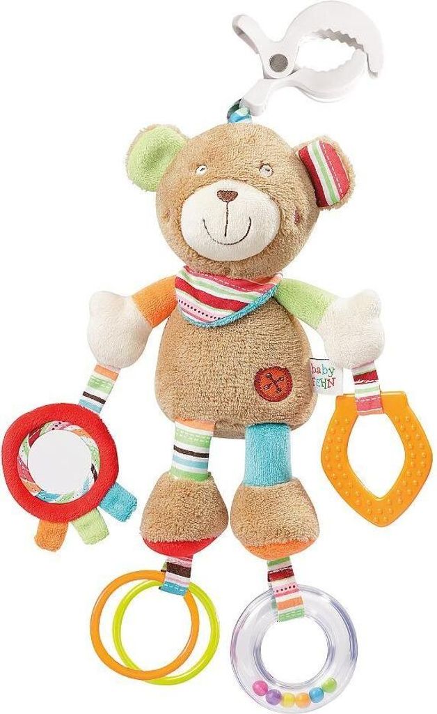 A plush teddy bear toy with various attachments for sensory play, suspended from a clip.