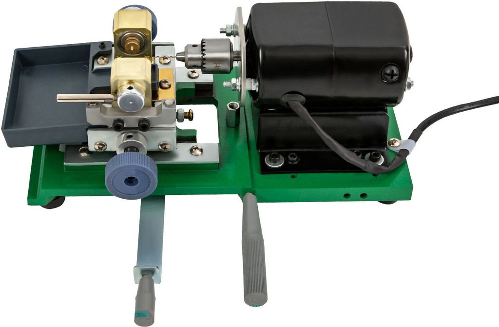A close-up studio shot of a pearl drilling machine on a white background.