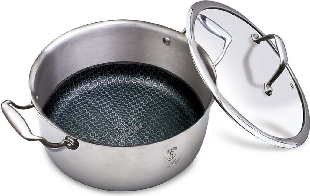 A stainless steel pot with a honeycomb pattern on the inside and a glass lid is shown.
