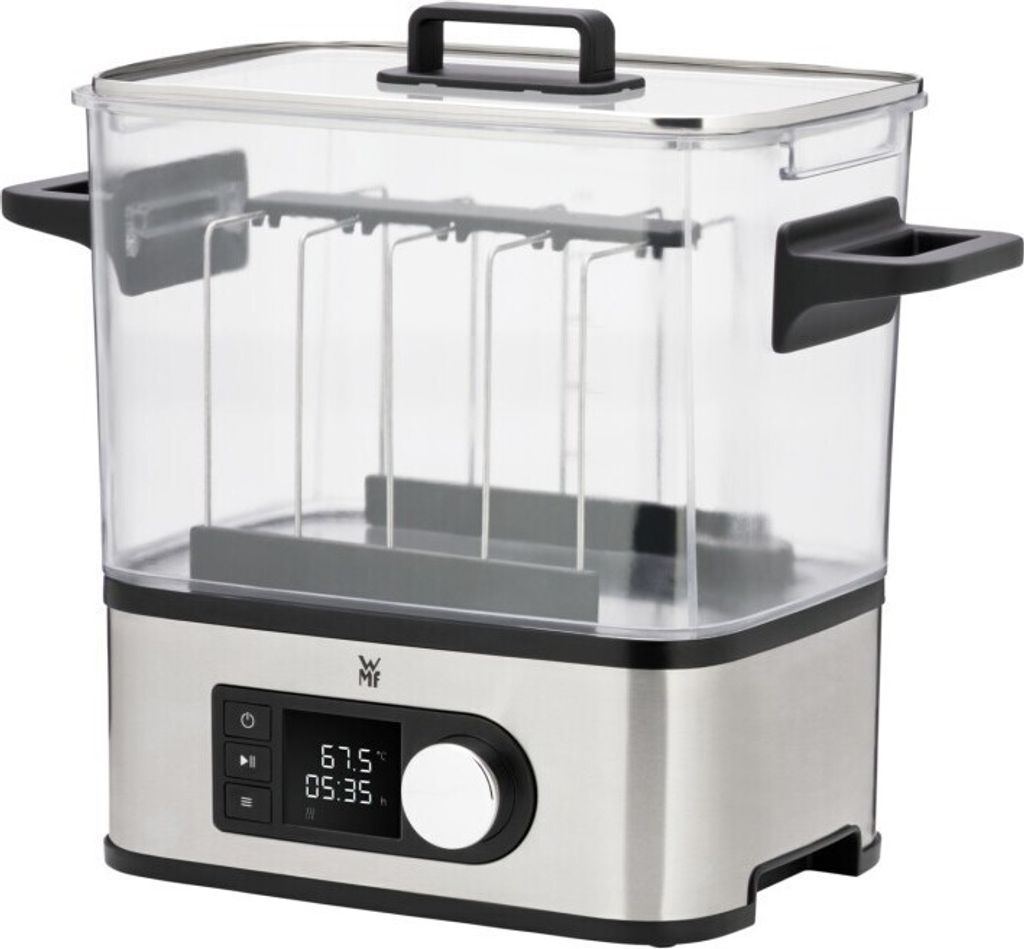 A silver and clear sous vide cooker with a digital display.