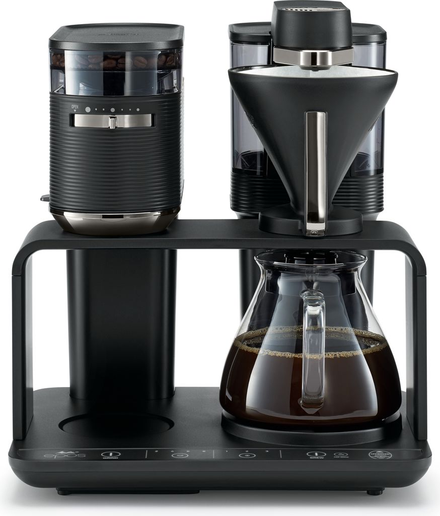A black Melitta coffee maker with a glass carafe filled with coffee.