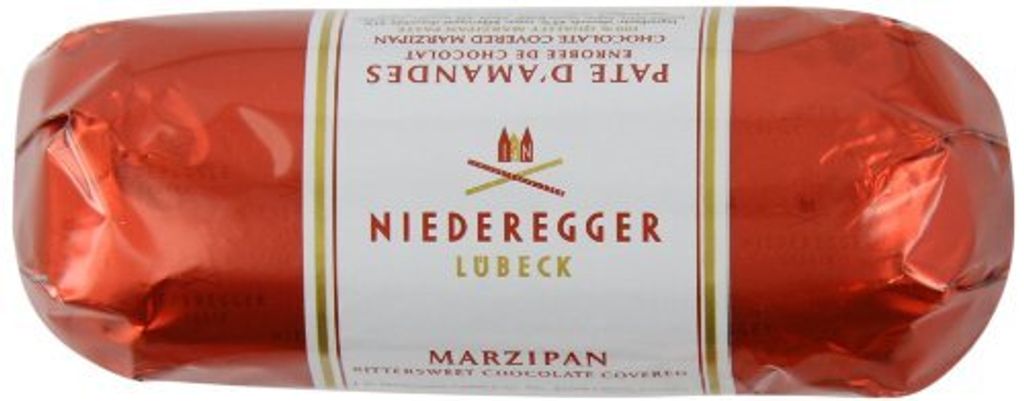 A red wrapped log of Niederegger marzipan with a white label.
