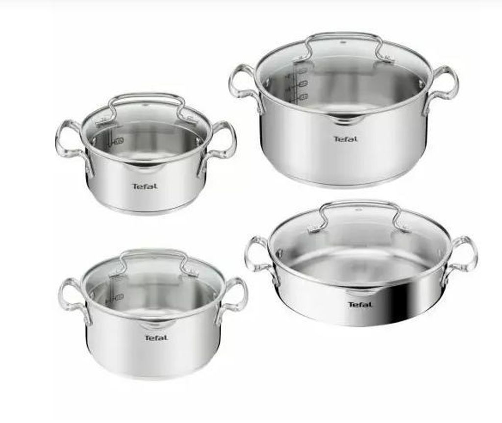 A set of four stainless steel pots with glass lids, arranged in a grid formation against a white background.