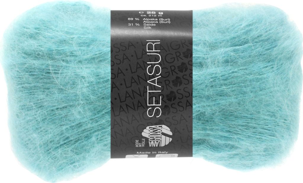 A ball of turquoise yarn with a black label.