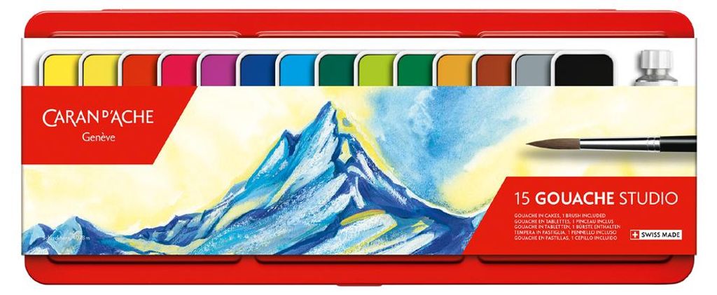 A box of CARAN D'ACHE Gouache Studio paints with a mountain landscape illustration.