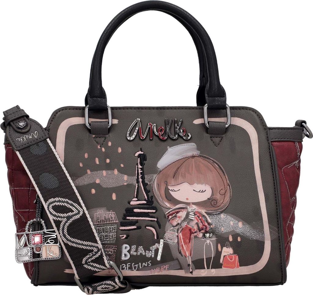 A handbag with a Paris-themed illustration.