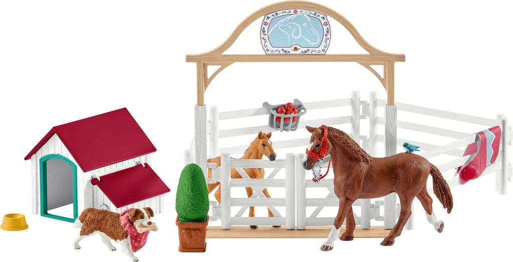 A toy farm set with horses, a dog, a dog house, and a stable.