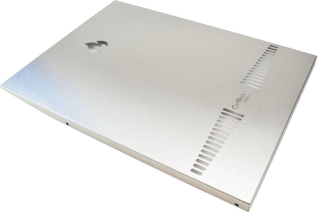 A silver-colored metal panel with ventilation slits and a logo.