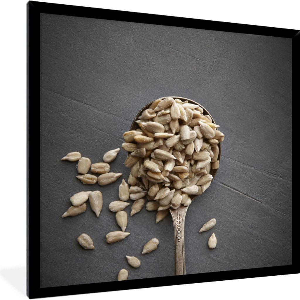 MuchoWow Gerahmtes Poster Weiße Sonnenblumenkerne auf einer grauen Oberfläche 40x40 cm - Poster mit Schwarzem Bilderrahmen Wandposter Rahmen Fo...