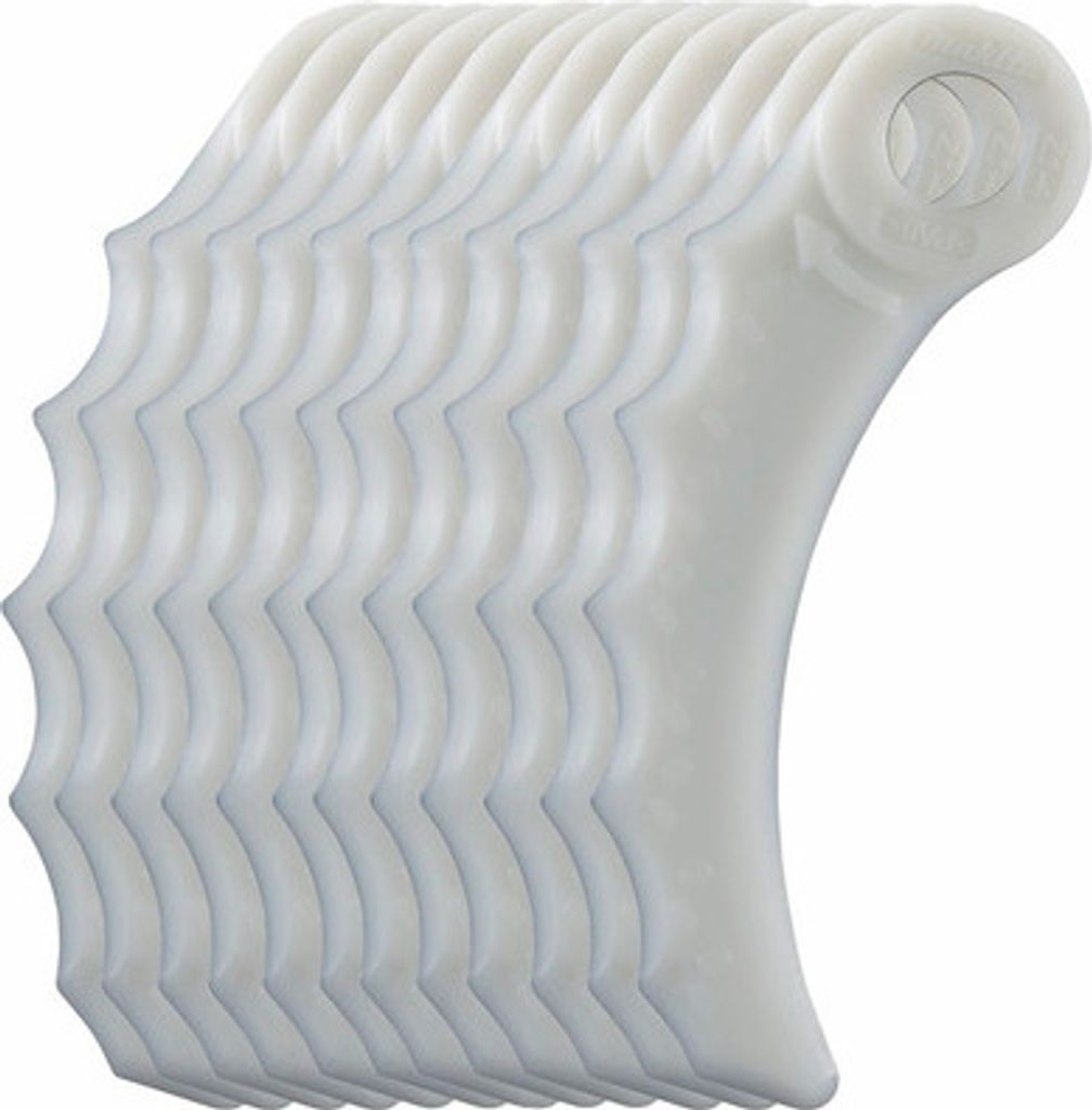 A stack of white plastic trimmer blades.