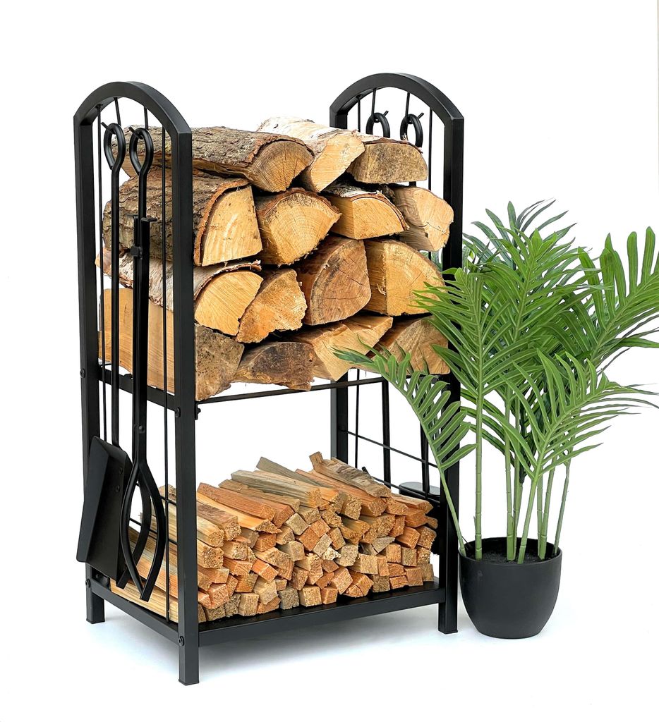 A black metal firewood rack filled with logs and a small green plant in a black pot next to it, on a white background.