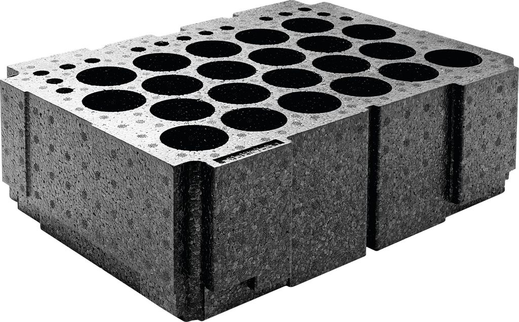 A dark gray foam insert with many circular openings, designed to hold items like vials or cartridges.
