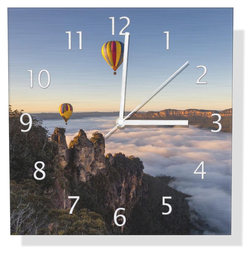 Wallario Design Wanduhr Ballons über Nebelmeer aus Aluverbund, Größe 30 x 30 cm