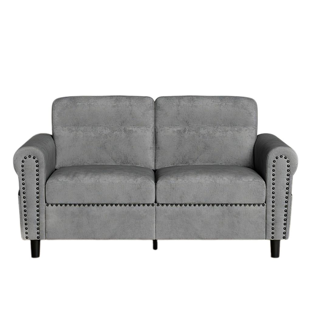 A studio shot of a gray sofa against a white background.