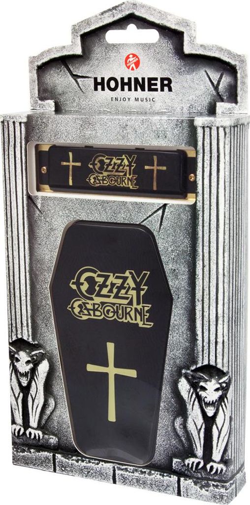A Hohner Ozzy Osbourne Signature Harp harmonica in its coffin-shaped packaging, with gargoyle figures on the sides.