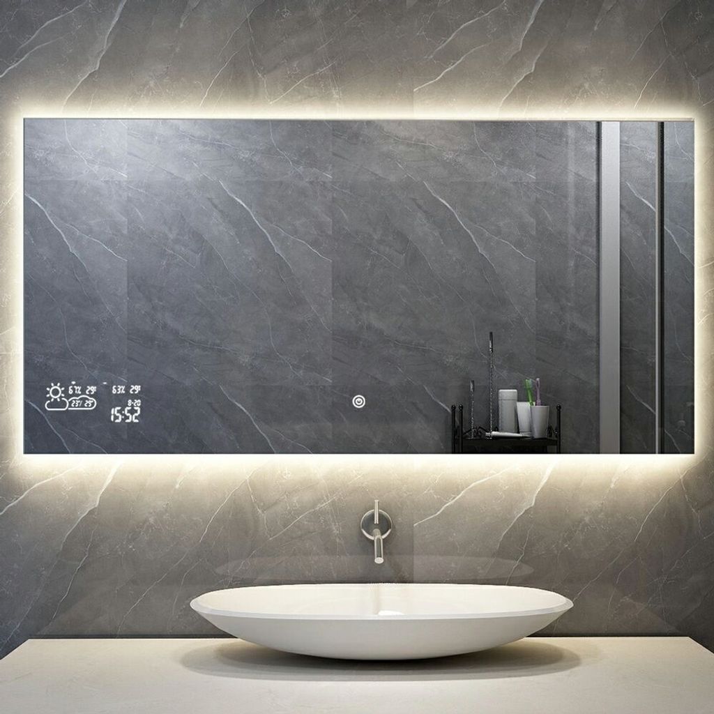 A modern bathroom with a smart mirror above a sink.