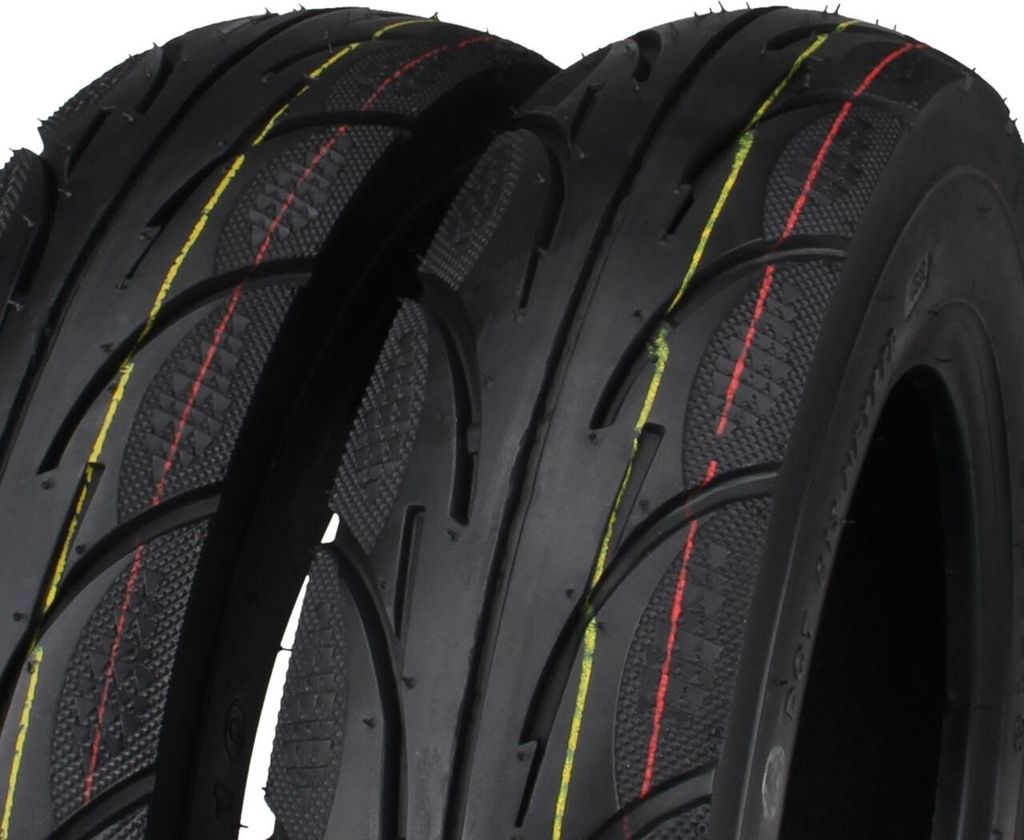 Close-up view of two black tires with red and yellow stripes.