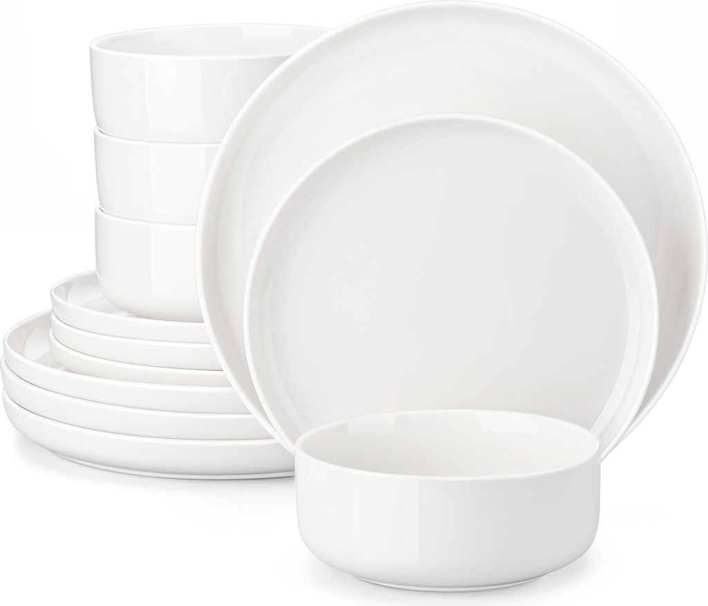 A stack of white ceramic plates and bowls.