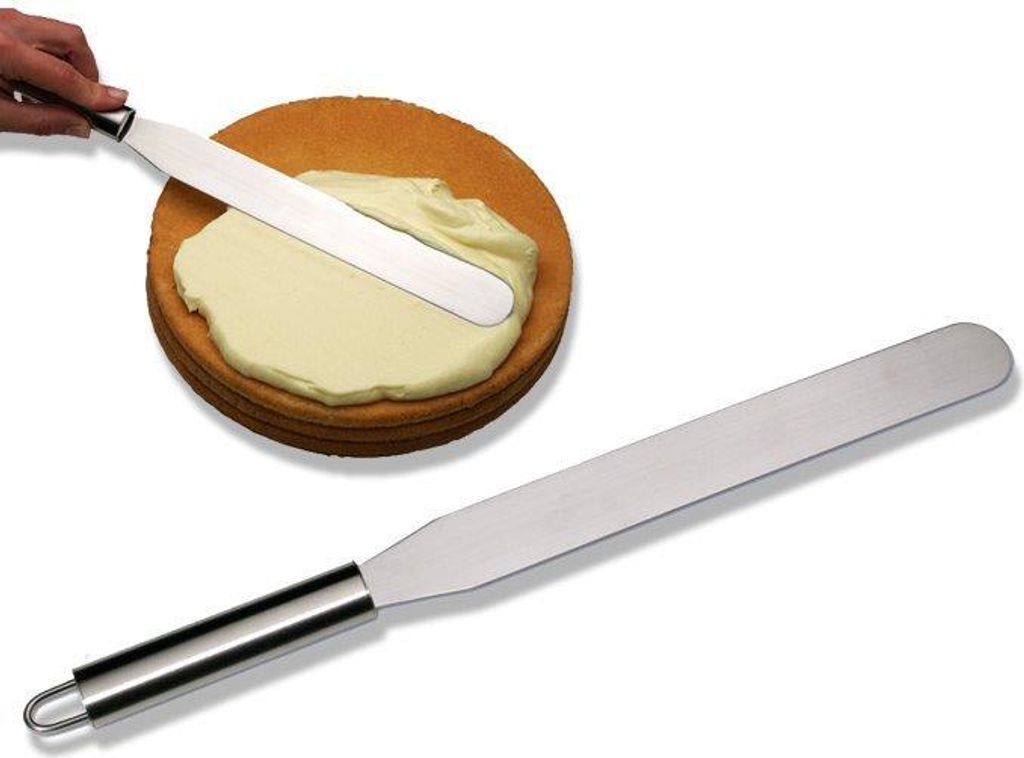 A hand is shown using a spatula to spread frosting on a cake layer. Another spatula is shown separately.