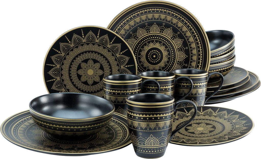 A set of black and gold mandala-patterned dinnerware, including plates, bowls, and mugs, is arranged on a white background.