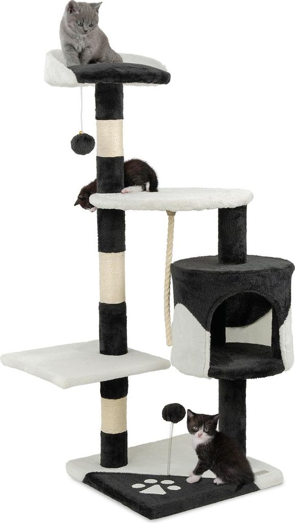 A cat tree with multiple levels and scratching posts, featuring three cats interacting with it.