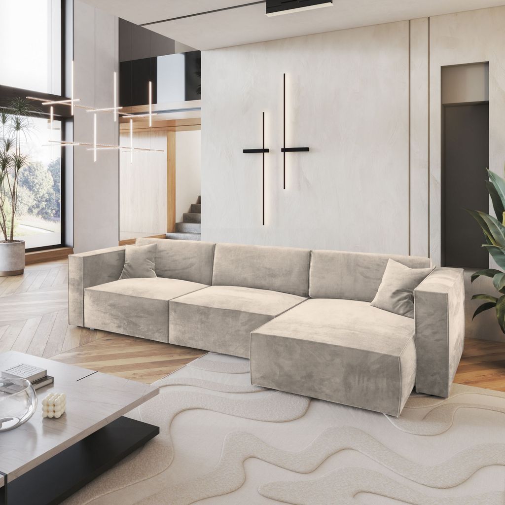 A modern living room with a large sectional sofa, coffee table, and abstract rug.