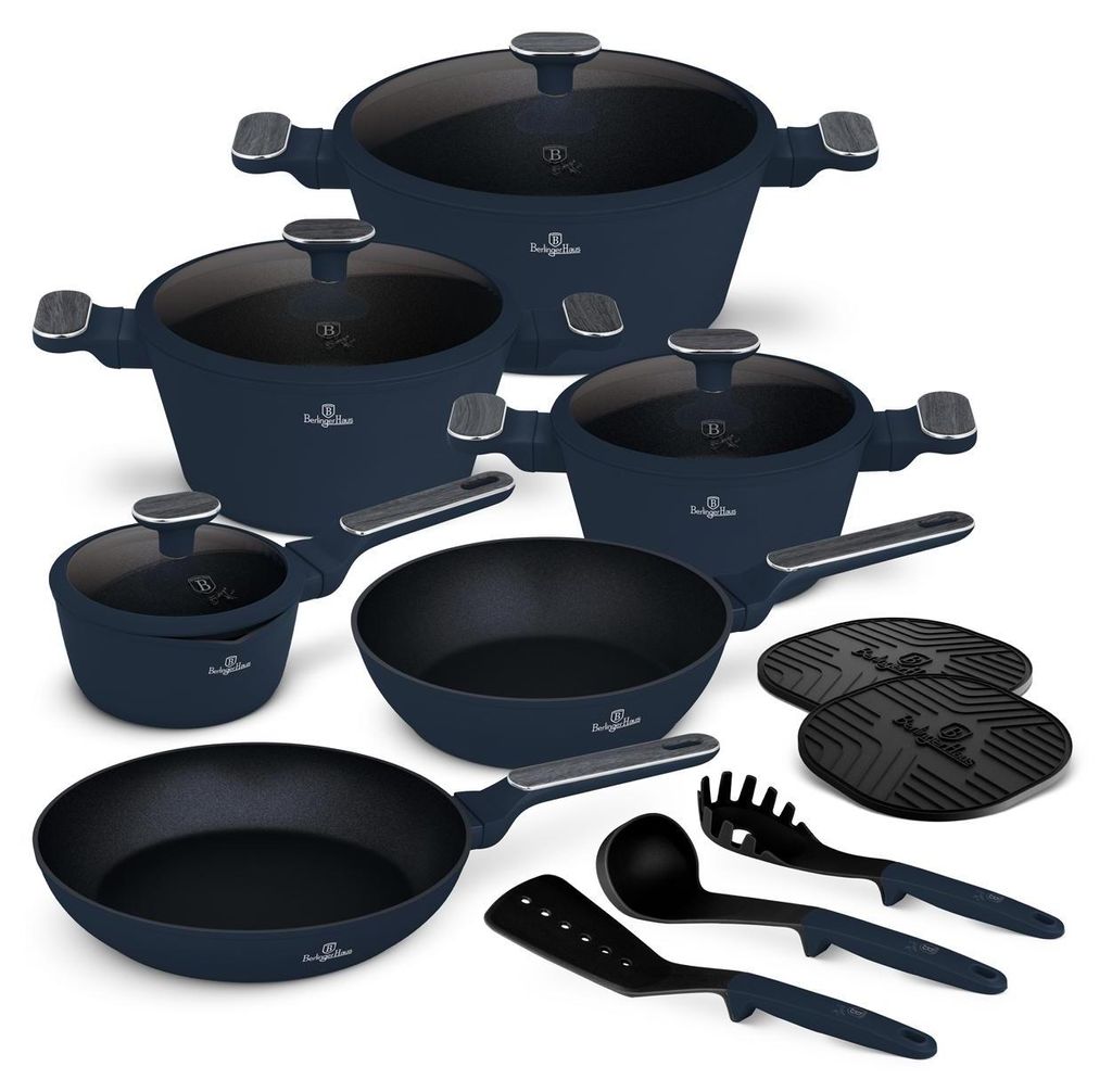 A collection of navy blue cookware and kitchen utensils arranged on a white background.