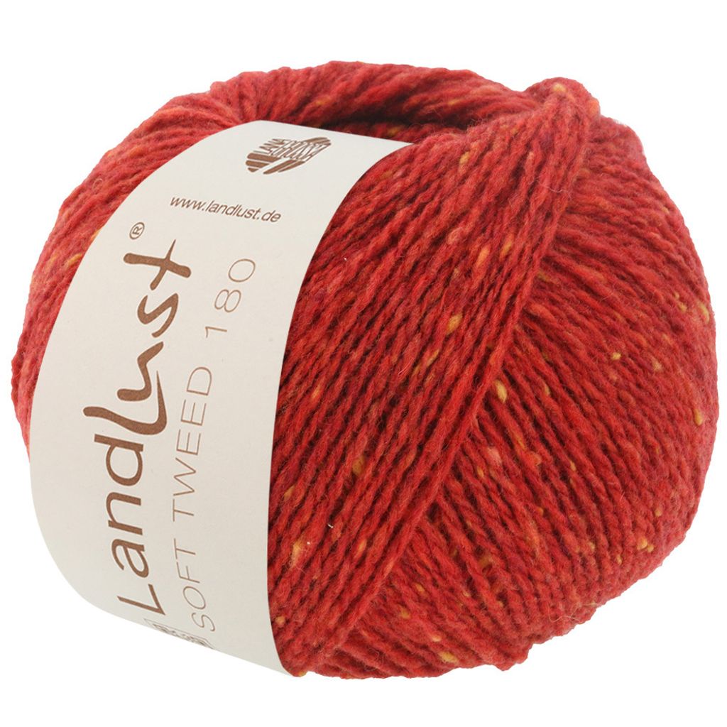 A ball of red tweed yarn with yellow flecks, featuring a label.
