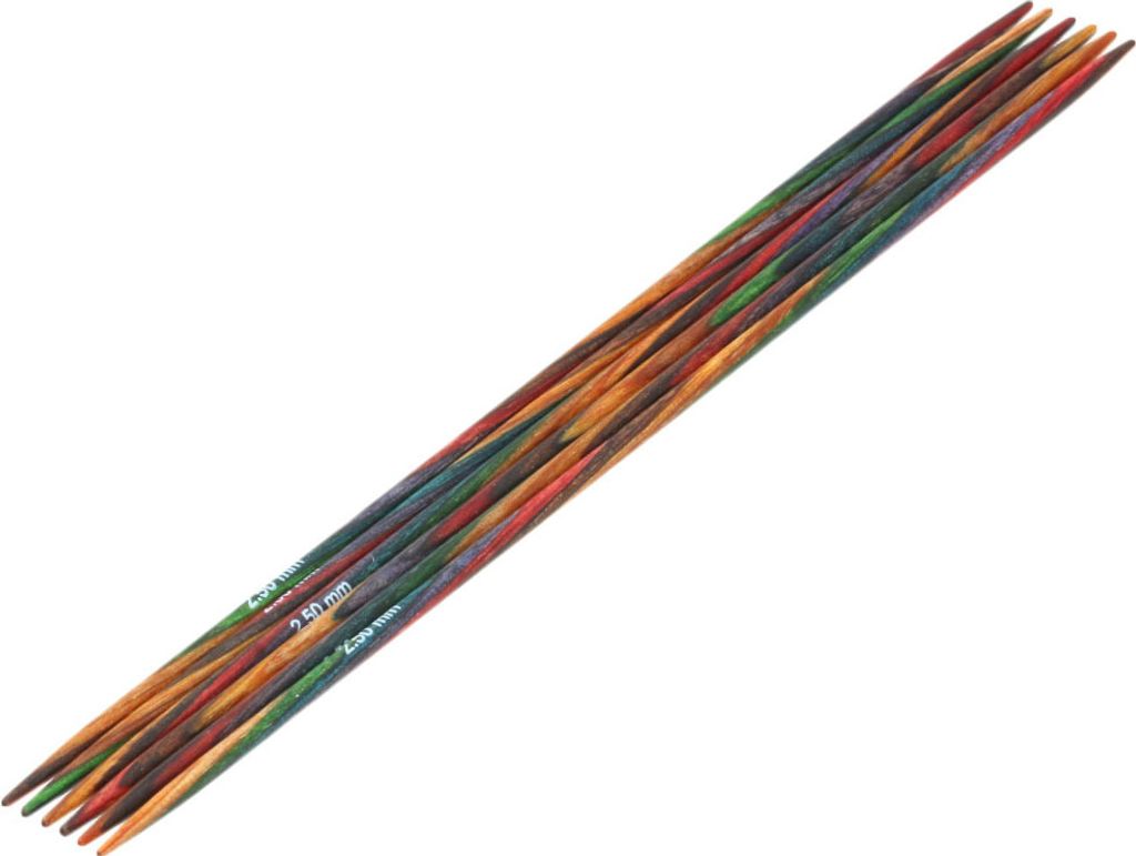 A set of knitting needles arranged diagonally on a white background.
