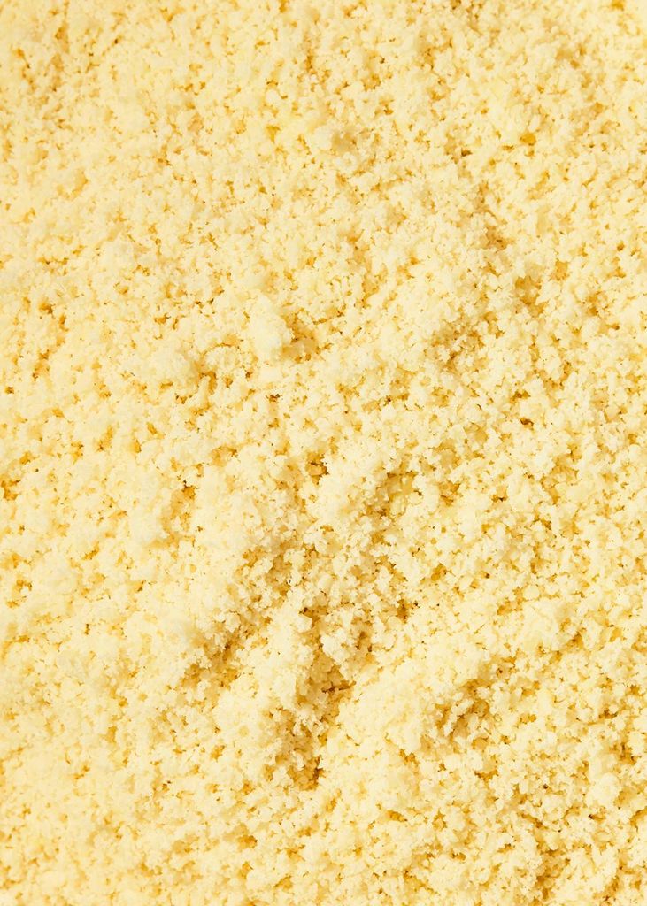 A close-up, overhead view of finely ground, blanched almonds.