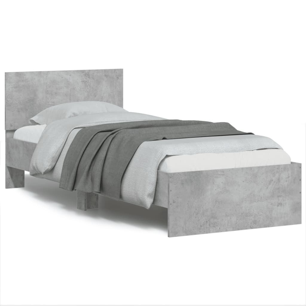 A single bed frame with a headboard, dressed with bedding and a throw blanket.