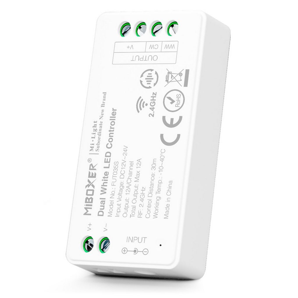 A white LED controller with labels and connection terminals.