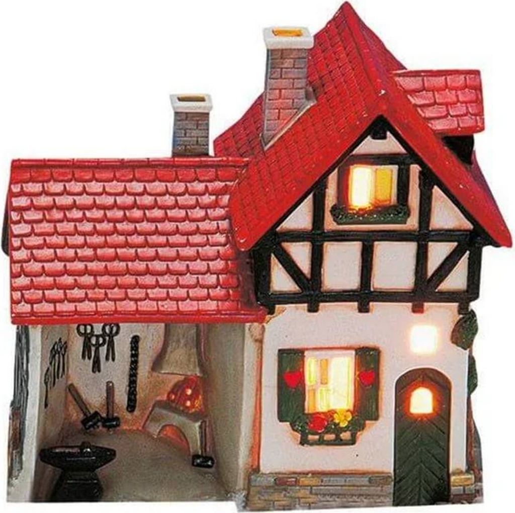 A miniature ceramic house designed to look like a blacksmith's forge.