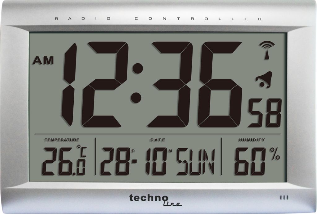 A digital clock displaying time, date, temperature, and humidity.