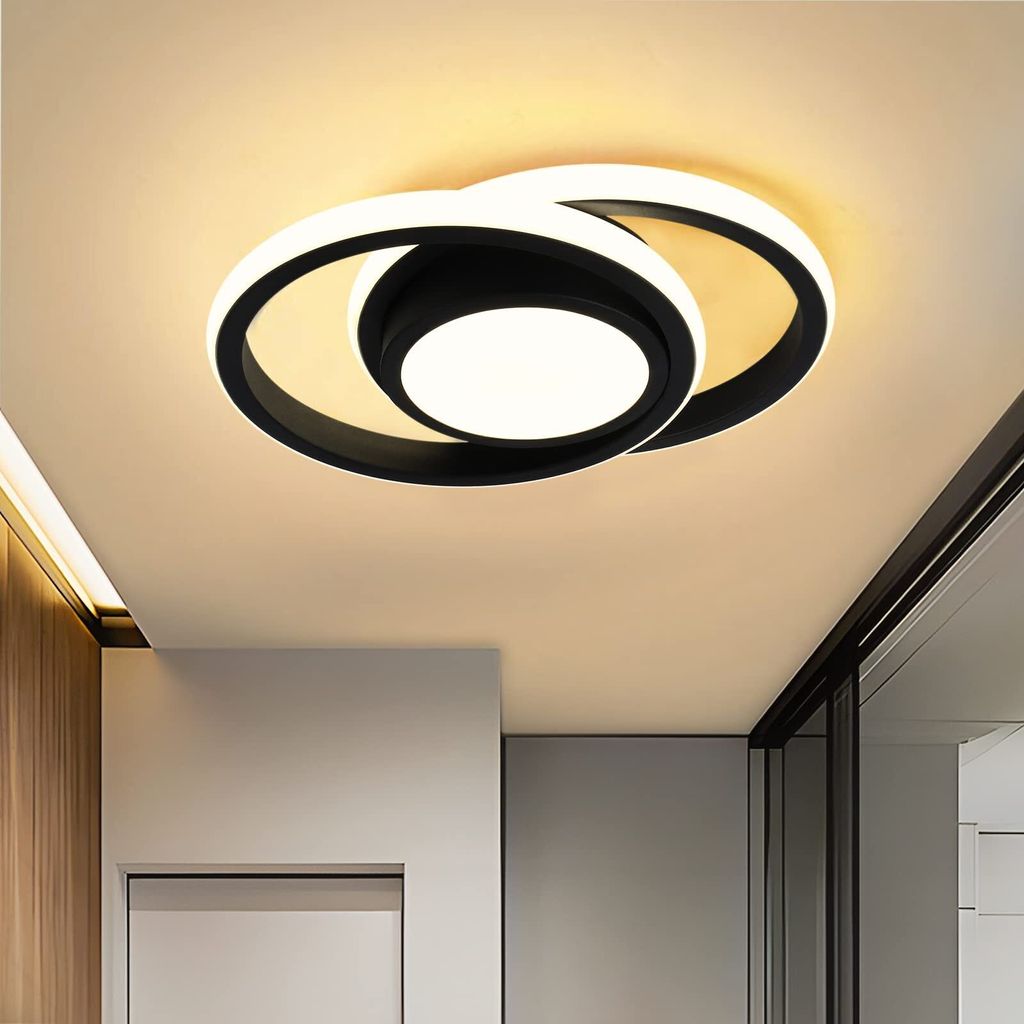 A modern ceiling light fixture in a hallway.