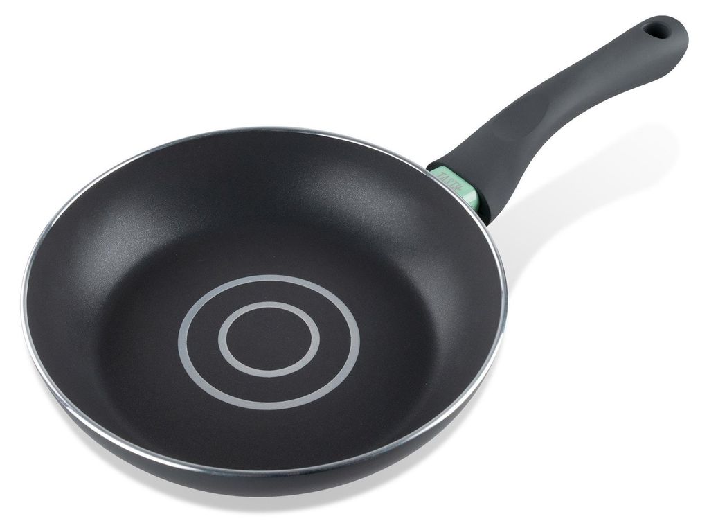 A black frying pan with a silver rim and a black handle with a green accent is shown against a white background.