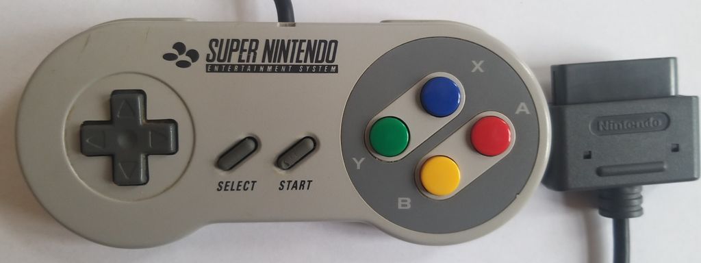 A Super Nintendo controller is shown on a white background.