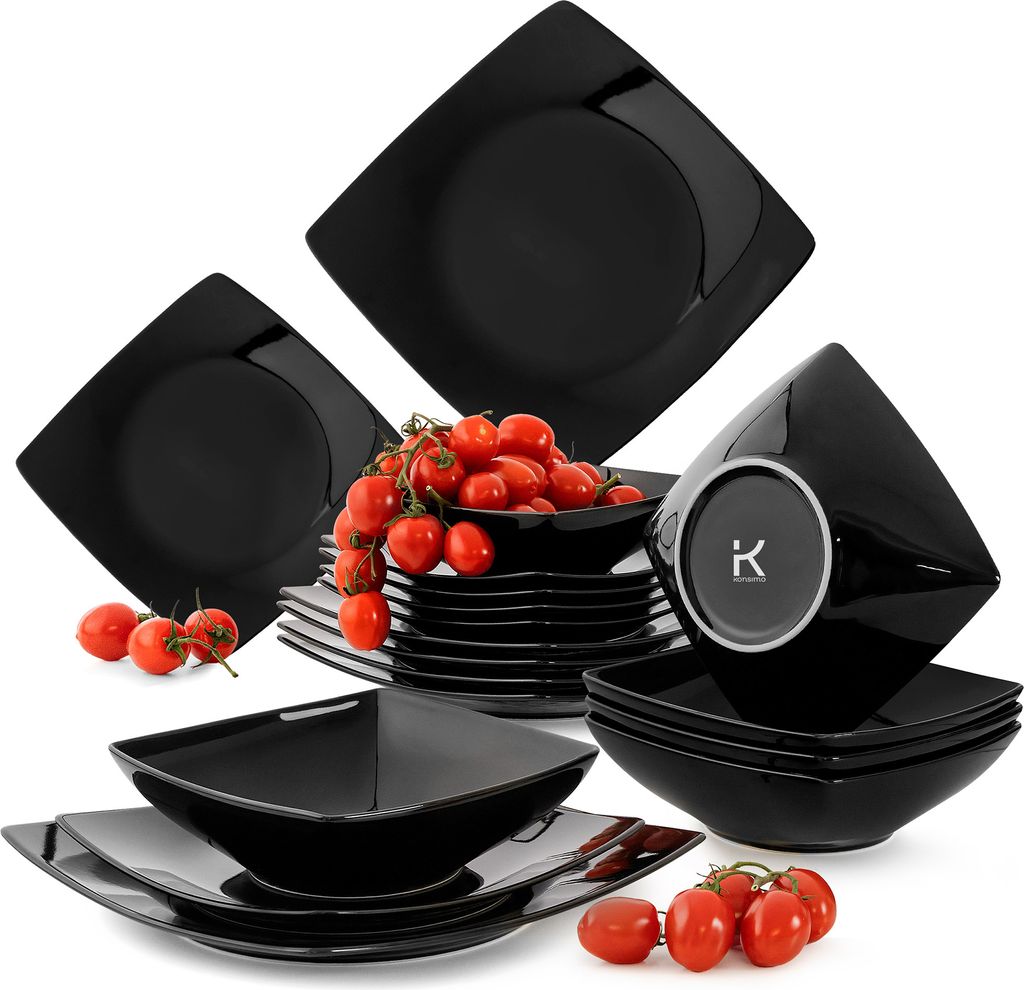 A set of black square dinnerware, including plates and bowls, with a bunch of cherry tomatoes on top of some of the plates.
