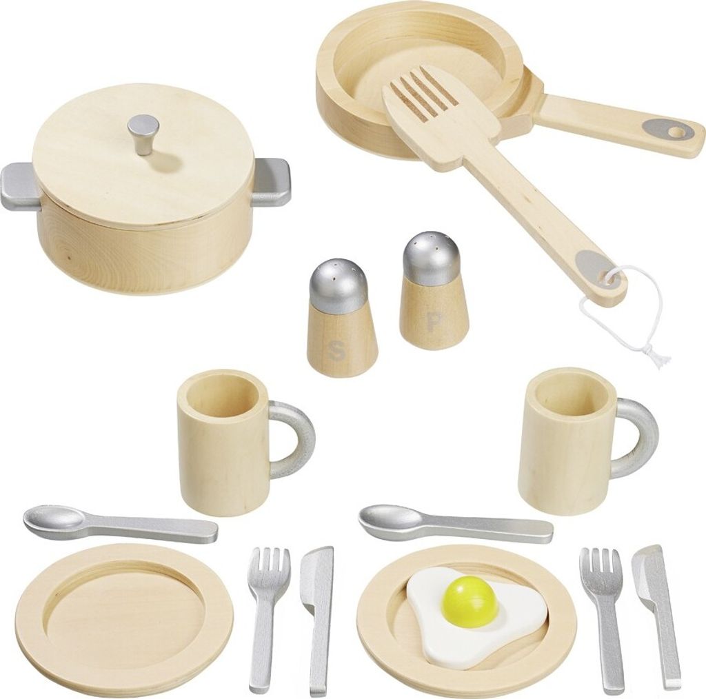 A collection of wooden toy kitchenware, including pots, pans, plates, cutlery, mugs, and salt and pepper shakers, arranged on a white background.