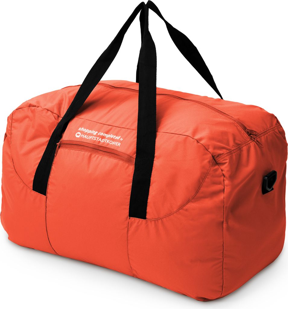 A studio shot of an orange duffel bag.