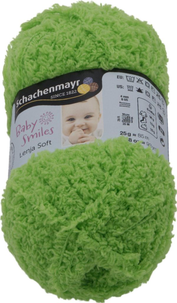 A ball of green yarn with a product label wrapped around it.