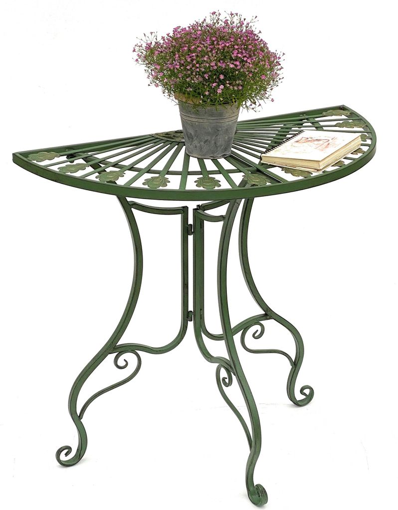A green metal half-round table with a potted plant and a book on it, set against a white background.
