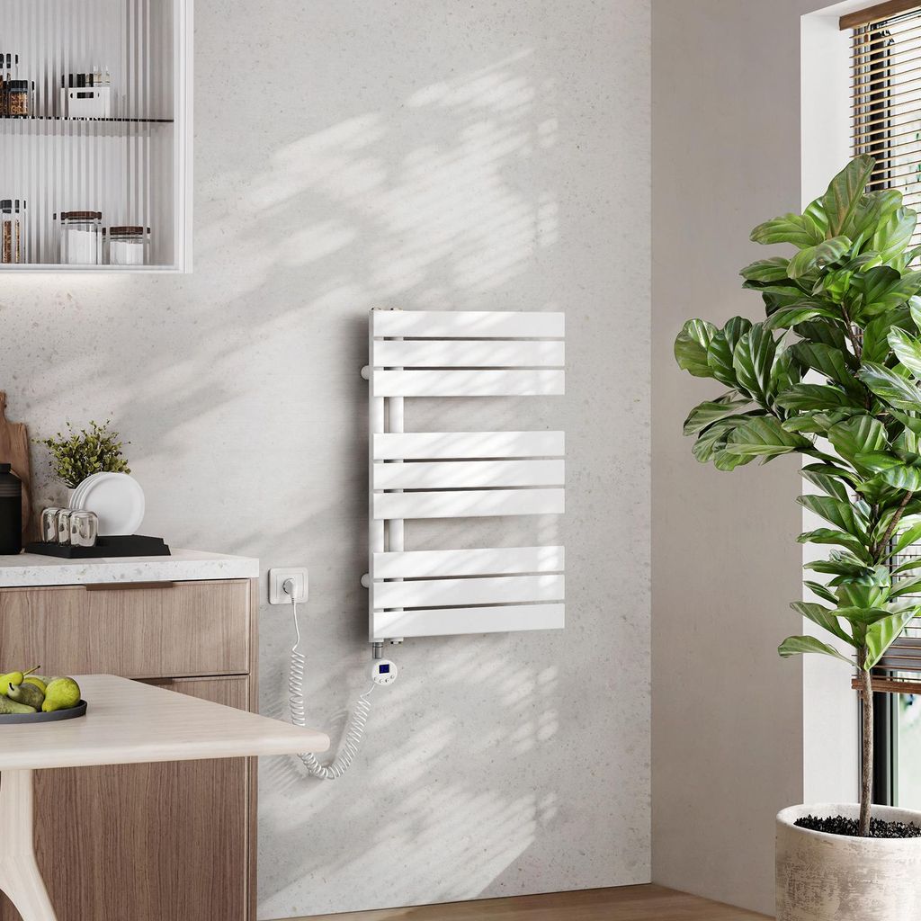 A modern bathroom or kitchen setting with a white electric towel warmer mounted on a textured gray wall.