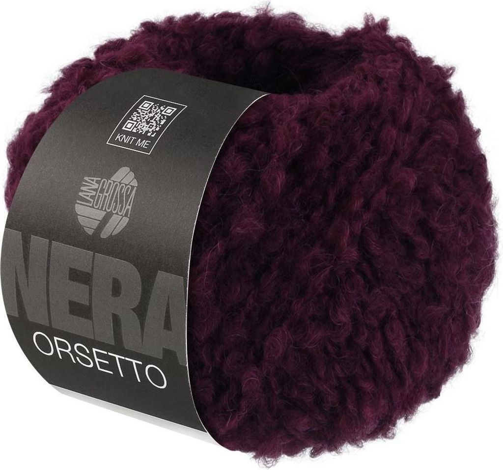 A ball of burgundy yarn with a label.