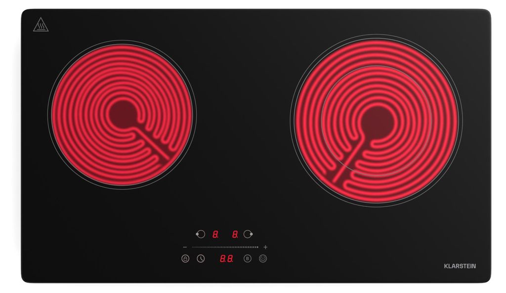 A top-down view of a black electric ceramic stovetop with two red heating elements.