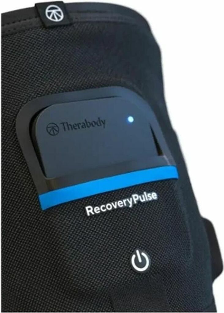 A close-up of a black compression sleeve with a blue accent and a black control unit attached.