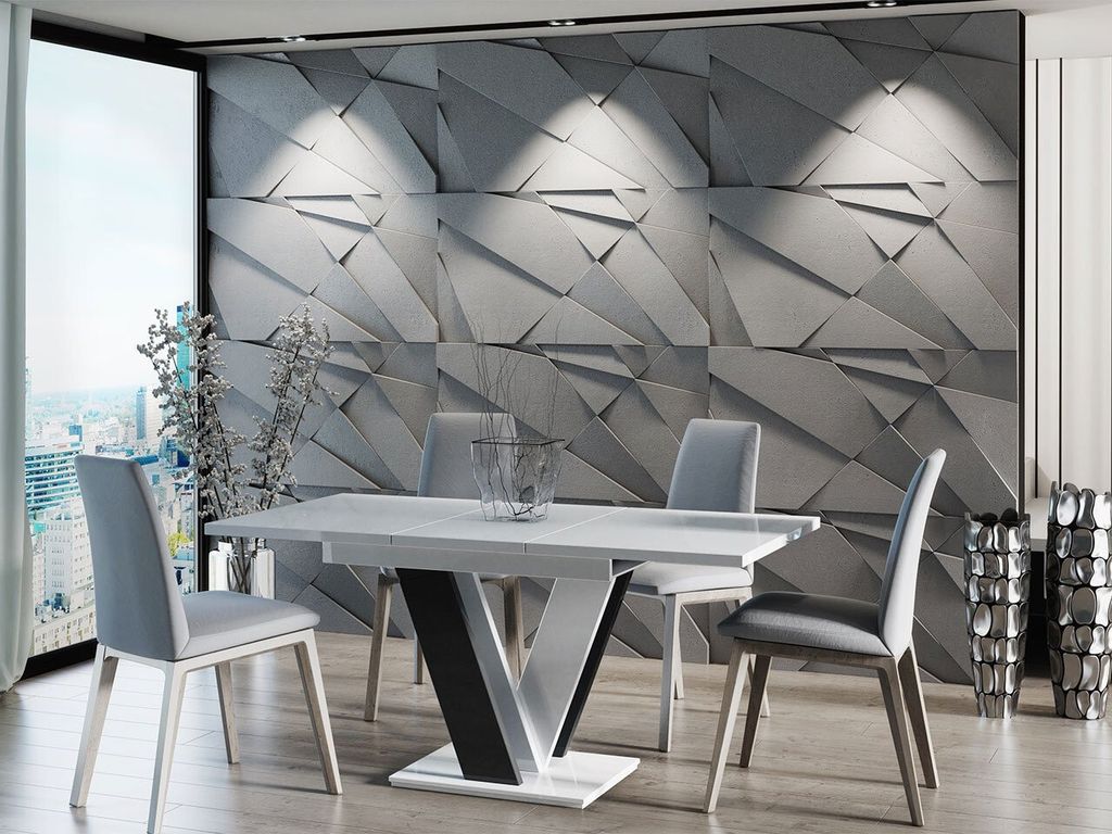A modern dining room with a geometric textured wall, a dining table and chairs, and decorative vases.